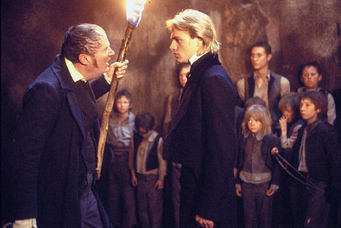 Broadbent as Sqeers and Hunnam as Nickleby